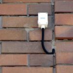 outdoor temperature sensor on the wall