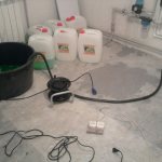 Filling the system with antifreeze using a submersible vibration pump.